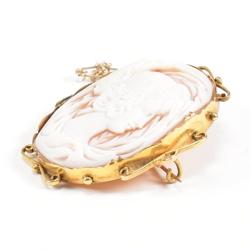 169 - A 9ct gold carved shell cameo brooch pin. Marked 9ct. Measures 4.5cm. Total weight 12.1g. All weight... 