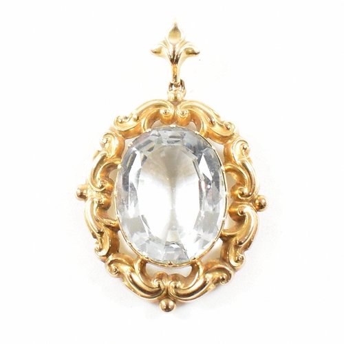 17 - A gold and aquamarine necklace pendant. The pendant set with an oval cut aquamarine within a rococo ... 