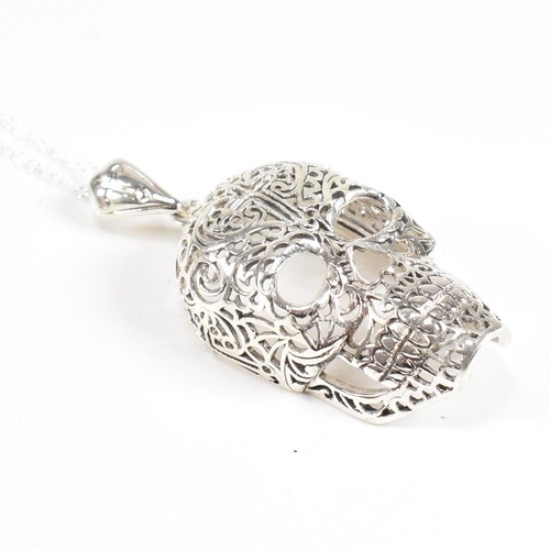 172 - A contemporary sterling silver novelty skull necklace. Weight approx 15.6g. Measures approx 4.3cm x ... 