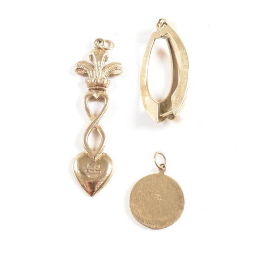 174 - Three hallmarked 9ct gold pendants. The pendant to include a royal wedding commemorative spoon, a mo... 