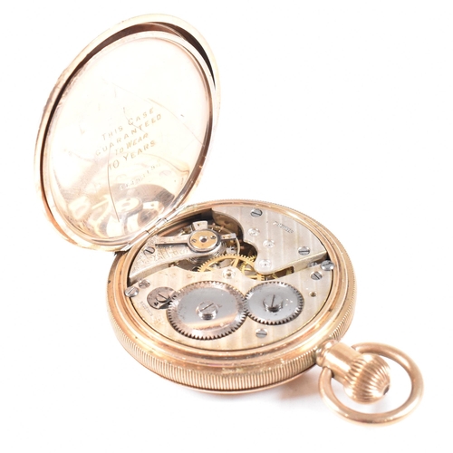 191 - An early 20th century gold plated full hunted pocket watch. The case being engine turned with cartou... 