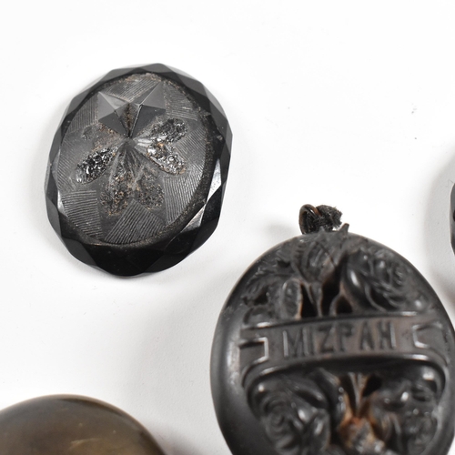 196 - A collection of 19th century jet and vulcanite lockets and pendants. The lockets to include a highly... 