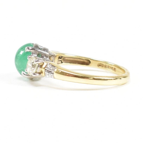 2 - A hallmarked 18ct gold emerald and diamond three stone ring. The ring set with a central emerald ova... 