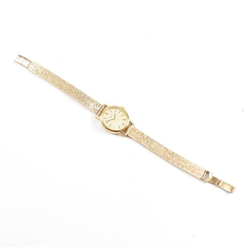 202 - A Longines wrist watch on a hallmarked 9ct gold strap. The Longines watch having a champagne dial wi... 