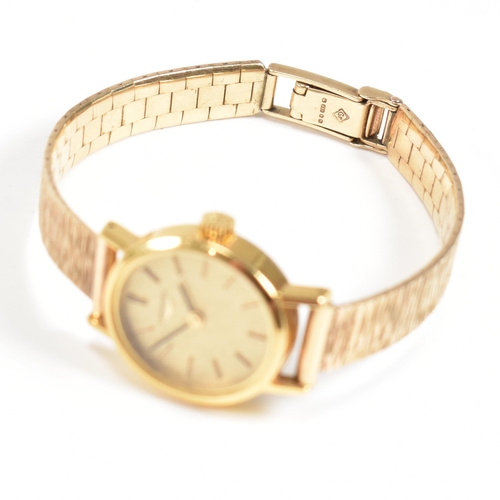 202 - A Longines wrist watch on a hallmarked 9ct gold strap. The Longines watch having a champagne dial wi... 