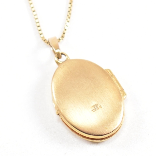 204 - A hallmarked 9ct gold locket pendant necklace. The locket having flower decoration strung on a fine ... 