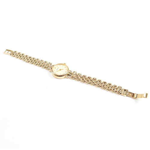 207 - 9ct Accurist gold ladies dress watch. The watch set with champagne roundel dial to 9ct bracelet stra... 