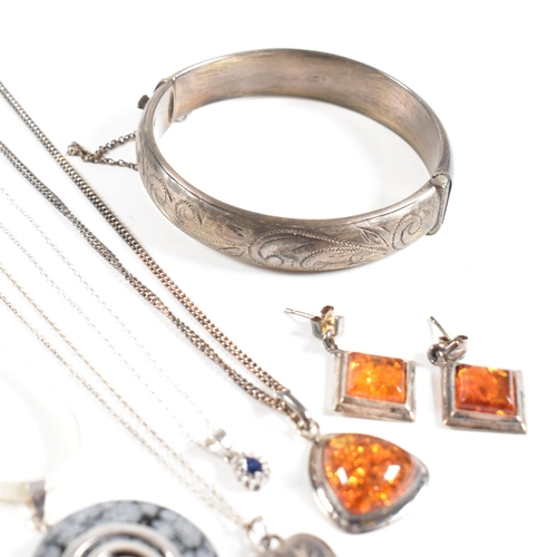 208 - An assortment of silver and gem set jewellery. The jewellery to include a pair of amber earrings and... 