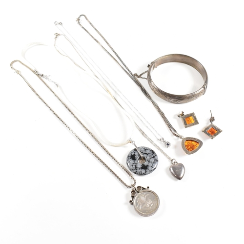 208 - An assortment of silver and gem set jewellery. The jewellery to include a pair of amber earrings and... 