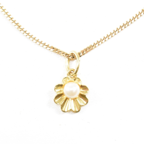 209 - A hallmarked 9ct gold and pearl pendant necklace. The necklace strung with a flower pendant set with... 