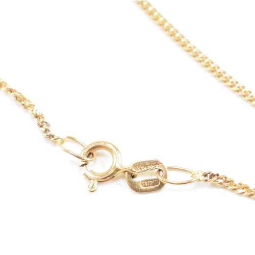 209 - A hallmarked 9ct gold and pearl pendant necklace. The necklace strung with a flower pendant set with... 