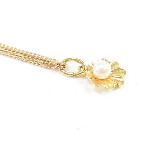 209 - A hallmarked 9ct gold and pearl pendant necklace. The necklace strung with a flower pendant set with... 