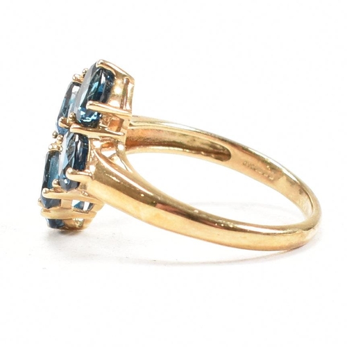 21 - A hallmarked 9ct gold and topaz cluster ring. Head measures 1.5cm. Weight 3.5g. Size O.5. All weight... 