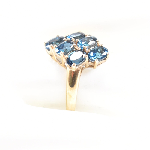 21 - A hallmarked 9ct gold and topaz cluster ring. Head measures 1.5cm. Weight 3.5g. Size O.5. All weight... 