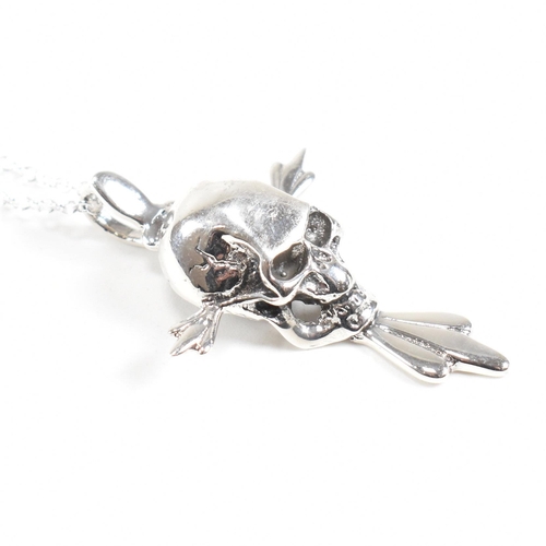 211 - A 925 contemporary silver skull pendant necklace. Stamped 925. Weight approx 9.8g. Measures approx 4... 