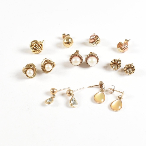 213 - An assortment of gold gem set and yellow metal earrings. The earring to include knot, pearl, topaz. ... 