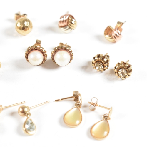 213 - An assortment of gold gem set and yellow metal earrings. The earring to include knot, pearl, topaz. ... 