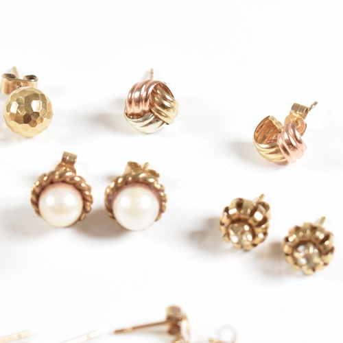 213 - An assortment of gold gem set and yellow metal earrings. The earring to include knot, pearl, topaz. ... 