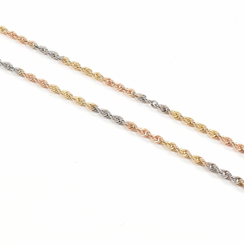 218 - A hallmarked 9ct gold tri colour rope twist chain necklace. Weight 2.5g. Measures 50cm. All weights,... 