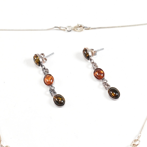 219 - A 925 silver and amber pendant necklace and earring suite. The necklace strung with a festoon pendan... 