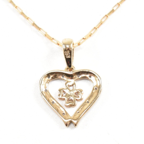 223 - A hallmarked 9ct gold pendant necklace. The necklace strung with a heart pendant on a fine link chai... 