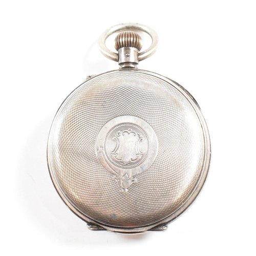 225 - An open faced silver 935 pocket watch  Stamped 935  with crown wind movement and bale atop. Enamel f... 