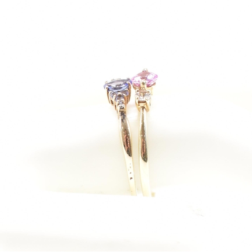 226 - Two hallmarked 9ct gold gem set rings. A synthetic sapphire and topaz ring and a tanzanite and diamo... 