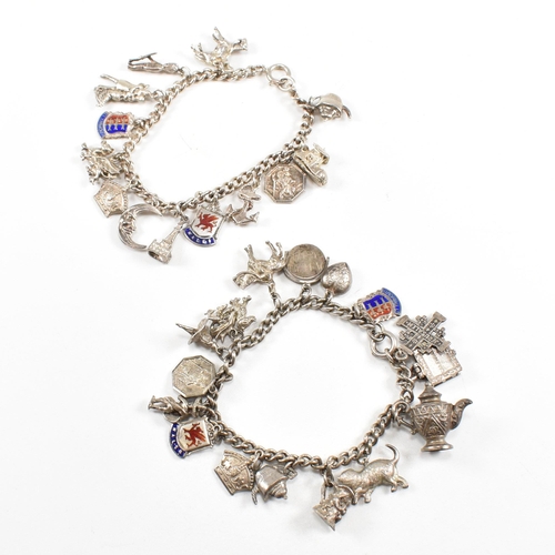 230 - Two silver and white metal charm bracelets adorned with multiple charms to include moon, Welsh drago... 