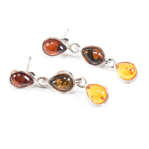 232 - A 925 silver and amber pendant necklace and earring suite. The necklace strung with a harlequin pend... 