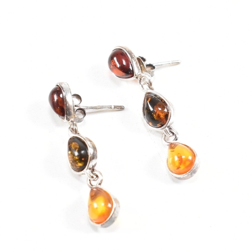 232 - A 925 silver and amber pendant necklace and earring suite. The necklace strung with a harlequin pend... 