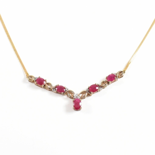 239 - A hallmarked 9ct gold ruby and diamond pendant necklace. Total weight 4.6g. Measures 45cm. All weigh... 