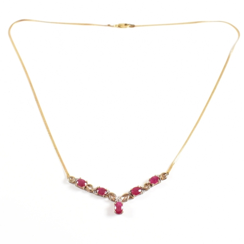 239 - A hallmarked 9ct gold ruby and diamond pendant necklace. Total weight 4.6g. Measures 45cm. All weigh... 