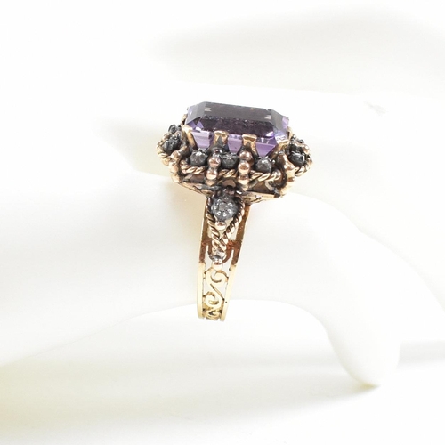 24 - Continental 18ct gold amethyst and diamond dress ring. The ring set with a large step cut amethyst f... 