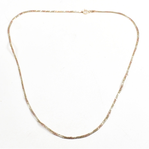 241 - Two hallmarked 9ct gold necklaces. A pendant necklace string with a CZ set pendant. A tri colour gol... 