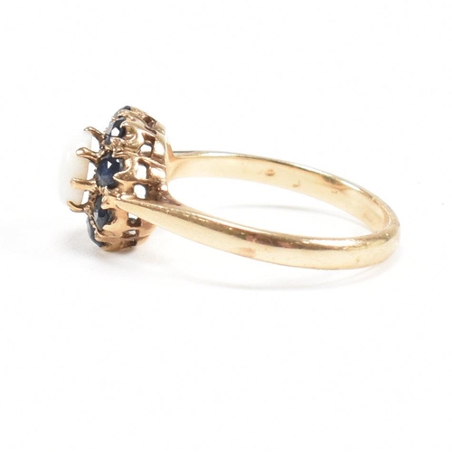 242 - A gold sapphire and opal cluster ring. Marks rubbed tests as 9ct gold. Weight 2.6g. Size N. All weig... 