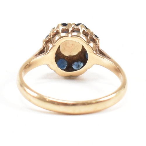 242 - A gold sapphire and opal cluster ring. Marks rubbed tests as 9ct gold. Weight 2.6g. Size N. All weig... 