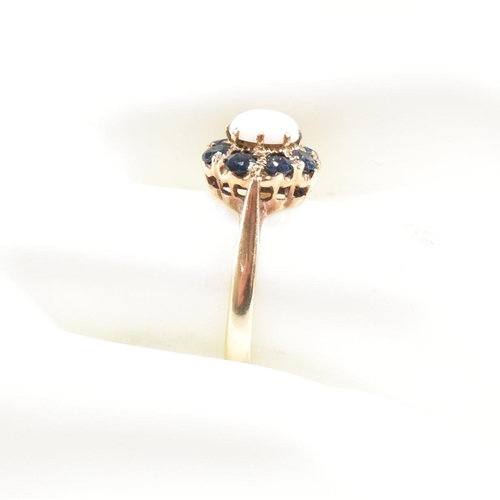 242 - A gold sapphire and opal cluster ring. Marks rubbed tests as 9ct gold. Weight 2.6g. Size N. All weig... 