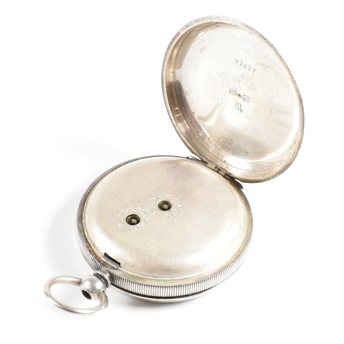 243 - An open faced silver 925 pocket watch  Stamped 925  with inset key wind movement and bale atop. Enam... 