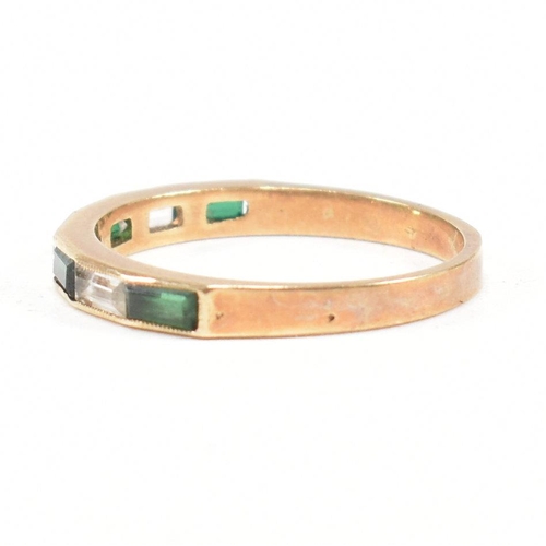 244 - A hallmarked 9ct gold synthetic spinel half hoop ring. The ring set with white and green baguette cu... 