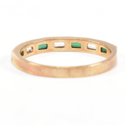 244 - A hallmarked 9ct gold synthetic spinel half hoop ring. The ring set with white and green baguette cu... 