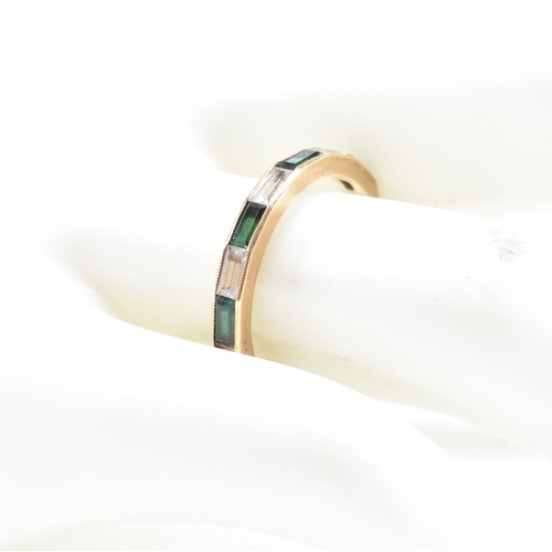 244 - A hallmarked 9ct gold synthetic spinel half hoop ring. The ring set with white and green baguette cu... 