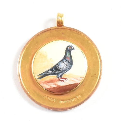 25 - A hallmarked 15ct gold enamel pigeon medal pendant. Hallmarked Birmingham. WHH for William Hair Hase... 