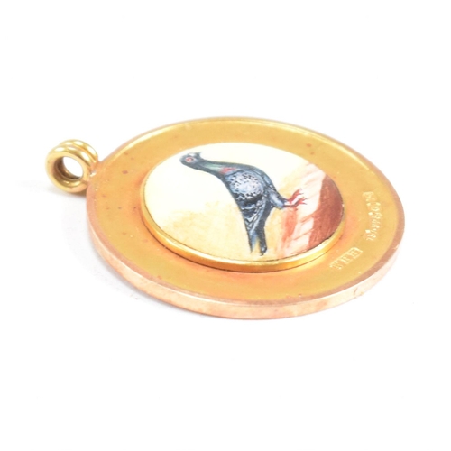 25 - A hallmarked 15ct gold enamel pigeon medal pendant. Hallmarked Birmingham. WHH for William Hair Hase... 