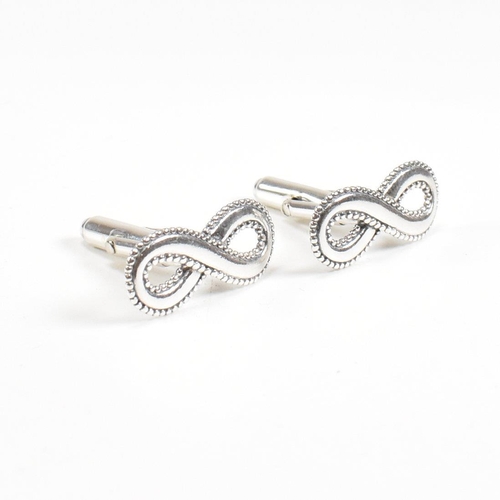 250 - A contemporary pair of 925 silver lucky eight cufflinks. Stamped 925. Weight approx 7.5g. Measures a... 