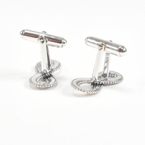 250 - A contemporary pair of 925 silver lucky eight cufflinks. Stamped 925. Weight approx 7.5g. Measures a... 