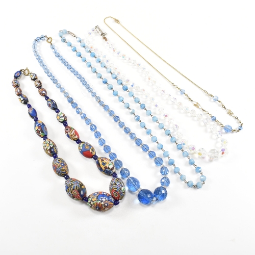 251 - A collection of early and mid century bead necklaces. The necklaces to include glass, early marbled ... 