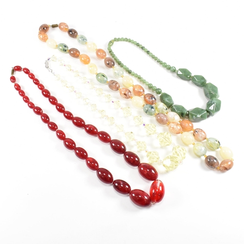 251 - A collection of early and mid century bead necklaces. The necklaces to include glass, early marbled ... 