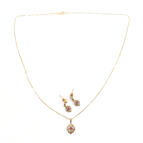 252 - A hallmarked 9ct gold and ruby pendant necklace and earring suite. Pendant hallmarked. Chain measure... 