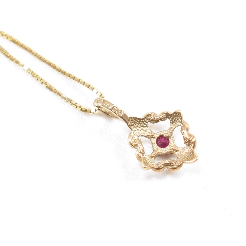 252 - A hallmarked 9ct gold and ruby pendant necklace and earring suite. Pendant hallmarked. Chain measure... 