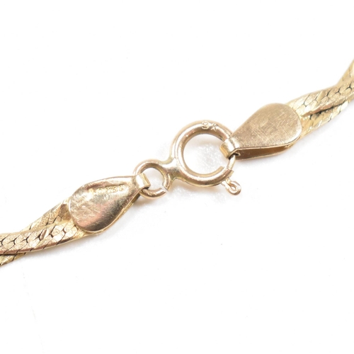 254 - A hallmarked 9ct gold flat snake chain bracelet. Weight 1.8g. Measures 17.5cm. All weights, measurem... 